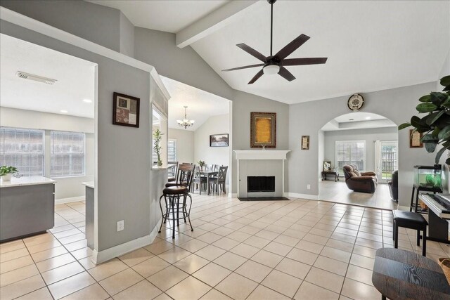 4138 Willow Bend Ln, Port Arthur, TX 77642 - living area with plenty of natural light, a ceiling fan, light tile patterned floors, and arched walkways