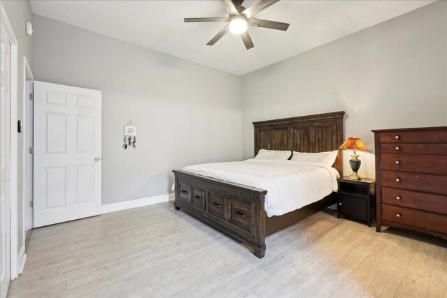 4138 Willow Bend Ln, Port Arthur, TX 77642 - bedroom featuring light wood-style flooring, baseboards, and a ceiling fan