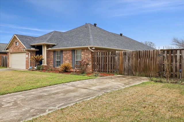 4138 Willow Bend Ln, Port Arthur, TX 77642 - view of front of house featuring brick siding, a garage, a shingled roof, and concrete driveway