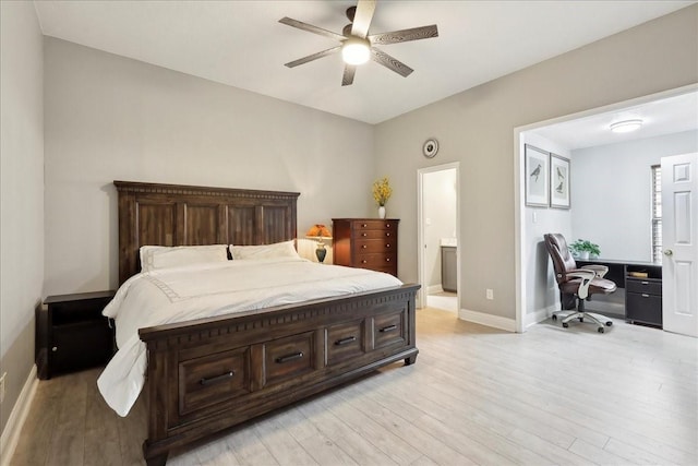 4138 Willow Bend Ln, Port Arthur, TX 77642 - bedroom featuring light wood-style floors, a desk, baseboards, and connected bathroom