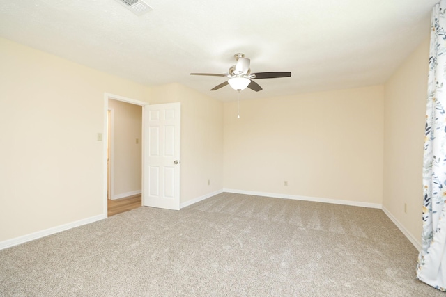 8606 Quail Vista Dr, Missouri City, TX 77489 - empty room with light colored carpet, ceiling fan, and baseboards