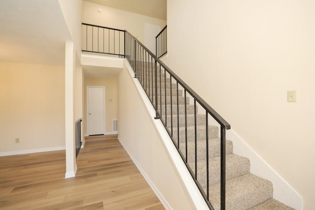 8606 Quail Vista Dr, Missouri City, TX 77489 - staircase with wood finished floors and baseboards