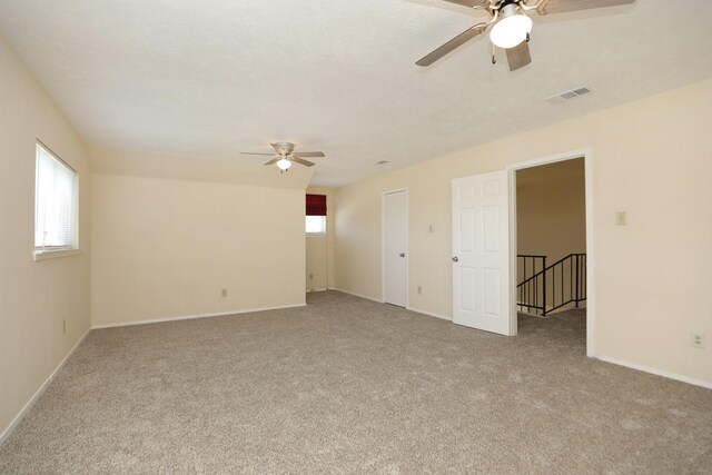 8606 Quail Vista Dr, Missouri City, TX 77489 - carpeted empty room with a ceiling fan and baseboards