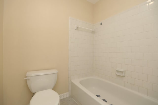 8606 Quail Vista Dr, Missouri City, TX 77489 - bathroom with toilet, baseboards, and tile patterned flooring
