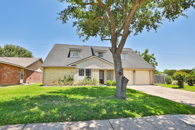8606 Quail Vista Dr, Missouri City, TX 77489 - view of front of home with brick siding, concrete driveway, roof with shingles, and an attached garage