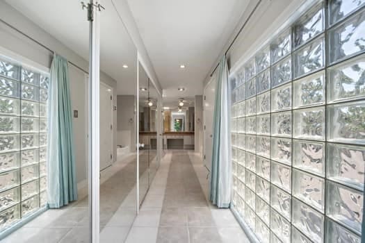 201 Vanderpool Ln Unit 118, Houston, TX 77024 - hallway featuring light tile patterned floors