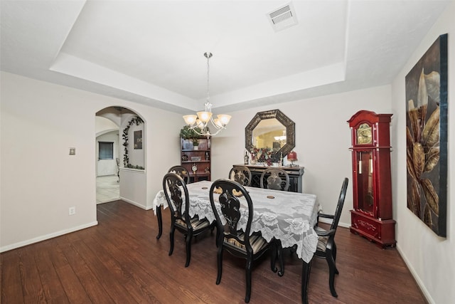 17335 Lake Clark Ln, Humble, TX 77346 - dining room with a tray ceiling, a chandelier, and dark wood finished floors