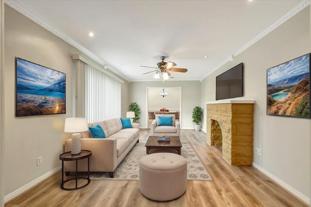 515 Canadian St, Houston, TX 77009 - living room with light wood-style flooring, baseboards, crown molding, ceiling fan, and a fireplace