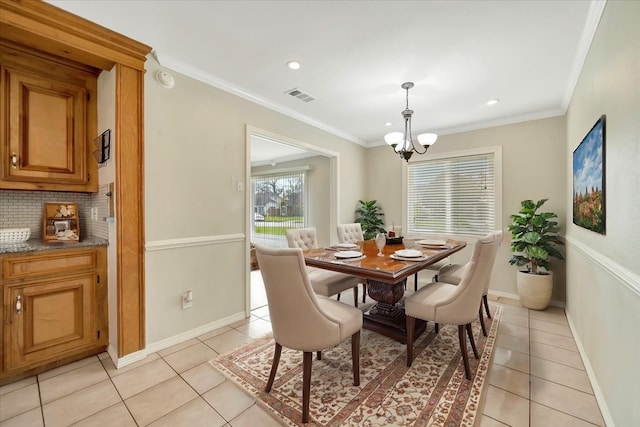 515 Canadian St, Houston, TX 77009 - dining area featuring a chandelier, light tile patterned flooring, baseboards, recessed lighting, and ornamental molding
