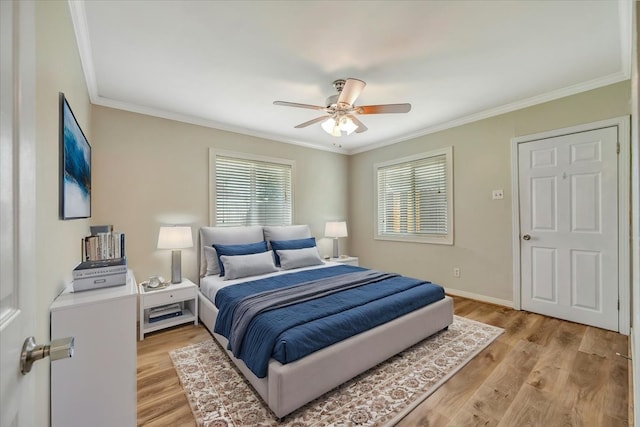 515 Canadian St, Houston, TX 77009 - bedroom featuring ornamental molding, light wood-style floors, ceiling fan, and baseboards