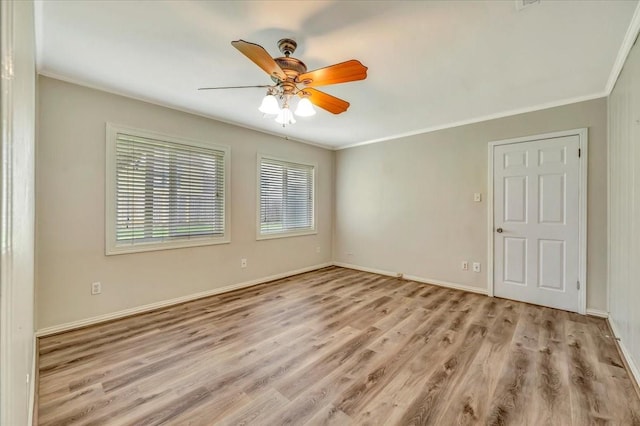 515 Canadian St, Houston, TX 77009 - unfurnished room with wood finished floors, ornamental molding, ceiling fan, and baseboards