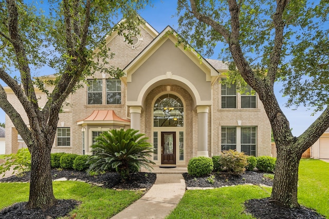 5539 Emerald Pointe Ct, Sugar Land, TX 77479 - traditional home with a front lawn and brick siding