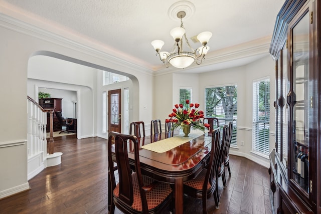 5539 Emerald Pointe Ct, Sugar Land, TX 77479 - dining space with arched walkways, a chandelier, dark wood-style floors, ornamental molding, and baseboards