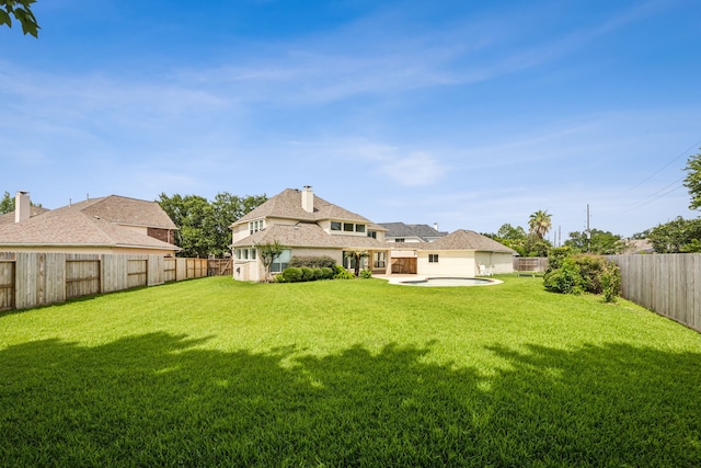 5539 Emerald Pointe Ct, Sugar Land, TX 77479 - back of house with a patio, stucco siding, and a chimney
