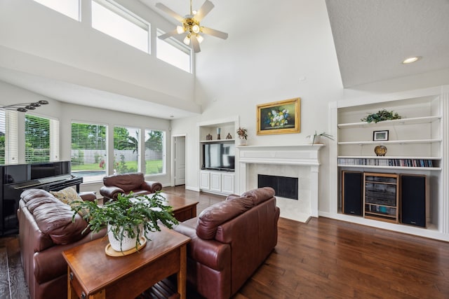 5539 Emerald Pointe Ct, Sugar Land, TX 77479 - living area featuring built in features, a premium fireplace, wood-type flooring, a ceiling fan, and a high ceiling
