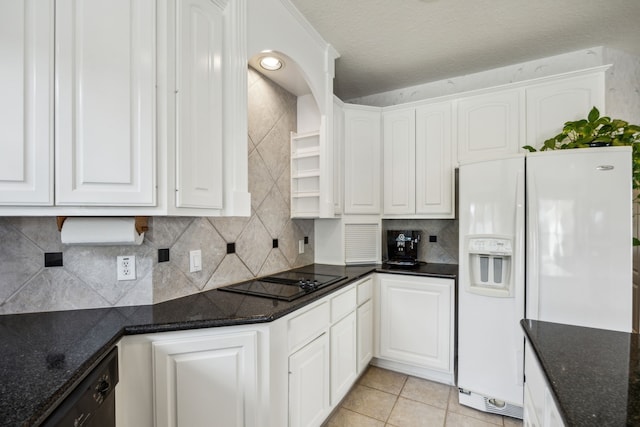 5539 Emerald Pointe Ct, Sugar Land, TX 77479 - kitchen featuring white fridge with ice dispenser, black electric cooktop, white cabinets, and dark stone counters
