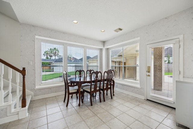 5539 Emerald Pointe Ct, Sugar Land, TX 77479 - dining room featuring baseboards, light tile patterned flooring, a textured ceiling, stairway, and recessed lighting