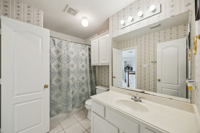 5539 Emerald Pointe Ct, Sugar Land, TX 77479 - bathroom featuring vanity, a textured ceiling, wallpapered walls, toilet, and tile patterned floors