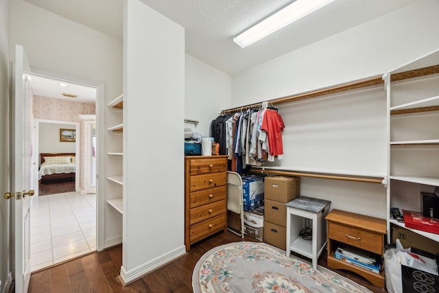 5539 Emerald Pointe Ct, Sugar Land, TX 77479 - walk in closet with dark wood finished floors