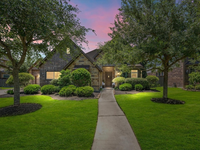 17611 Bear River Ln, Humble, TX 77346 - view of front of property featuring a yard and brick siding