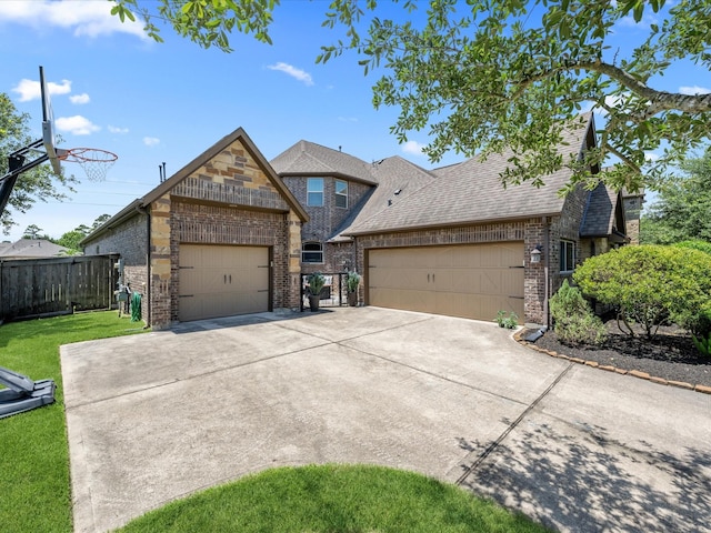 17611 Bear River Ln, Humble, TX 77346 - view of front of house featuring brick siding, roof with shingles, an attached garage, and concrete driveway