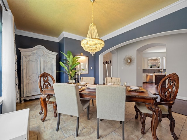 17611 Bear River Ln, Humble, TX 77346 - dining space with arched walkways, a chandelier, and crown molding
