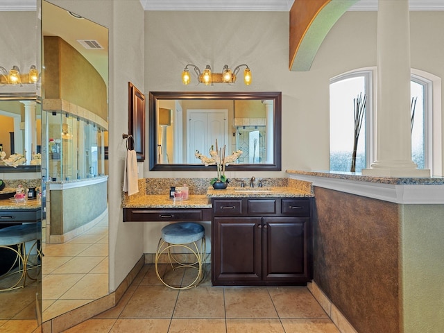 17611 Bear River Ln, Humble, TX 77346 - bathroom featuring crown molding, a shower, ornate columns, vanity, and tile patterned flooring