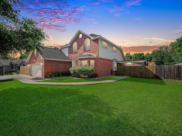3106 Lake Breeze Ln, Crosby, TX 77532 - back of property at dusk with brick siding and concrete driveway