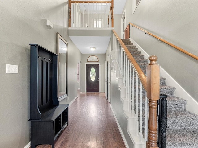 3106 Lake Breeze Ln, Crosby, TX 77532 - entryway with wood finished floors, stairway, a high ceiling, and baseboards