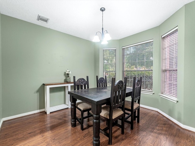 3106 Lake Breeze Ln, Crosby, TX 77532 - dining room with dark wood finished floors, a chandelier, and baseboards