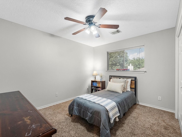 3106 Lake Breeze Ln, Crosby, TX 77532 - carpeted bedroom with baseboards, a textured ceiling, and a ceiling fan