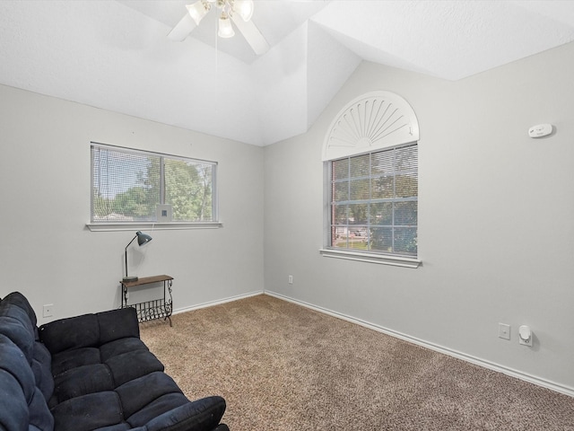 3106 Lake Breeze Ln, Crosby, TX 77532 - carpeted living area featuring vaulted ceiling, ceiling fan, and baseboards