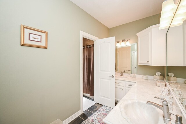 23442 Hillcrest Dr, Hockley, TX 77447 - bathroom with double vanity, a shower with shower curtain, and baseboards