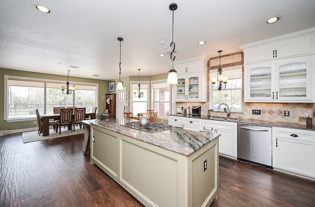 23442 Hillcrest Dr, Hockley, TX 77447 - kitchen featuring stainless steel appliances, a sink, a chandelier, a kitchen island, and dark wood-style floors