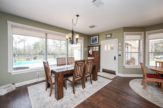 23442 Hillcrest Dr, Hockley, TX 77447 - dining area with a chandelier, plenty of natural light, baseboards, and dark wood finished floors