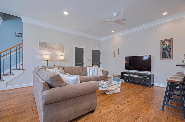 804 Enid St Unit A, Houston, TX 77009 - living room with crown molding, light wood-style floors, stairs, a ceiling fan, and baseboards