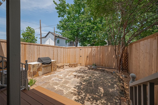 804 Enid St Unit A, Houston, TX 77009 - wooden deck with a fenced backyard, a patio, and a grill