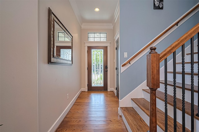 804 Enid St Unit A, Houston, TX 77009 - foyer featuring ornamental molding, stairs, baseboards, wood finished floors, and recessed lighting