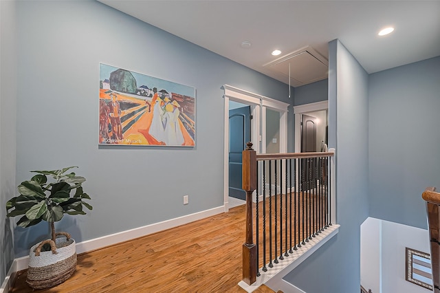 804 Enid St Unit A, Houston, TX 77009 - hall featuring attic access, an upstairs landing, wood finished floors, baseboards, and recessed lighting