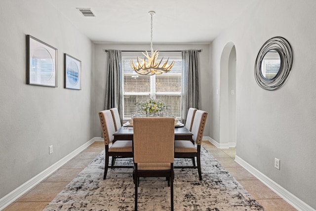 21734 Parsley Mist Ln, Richmond, TX 77469 - dining area with a chandelier, baseboards, and light tile patterned floors