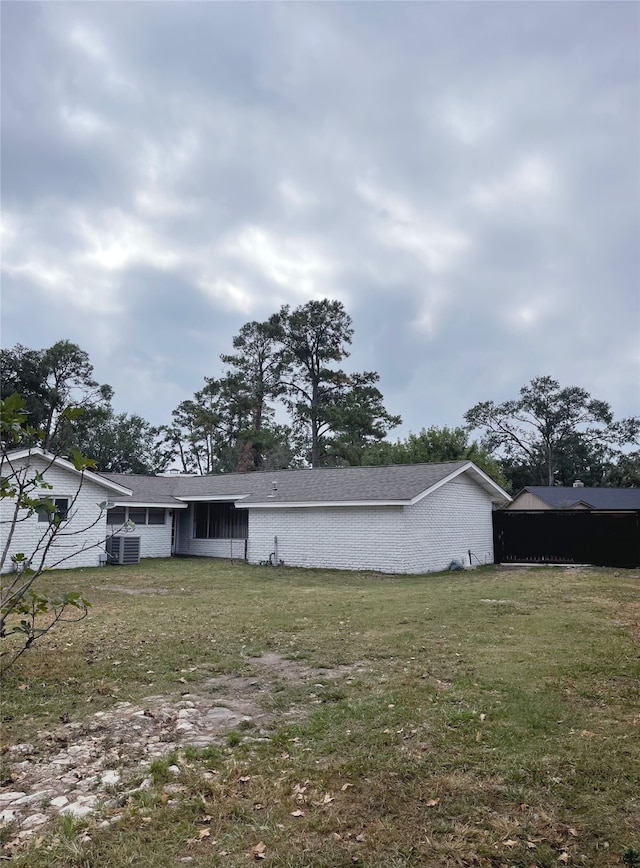 10214 Moorberry Ln, Houston, TX 77043 - back of property featuring a yard and central AC