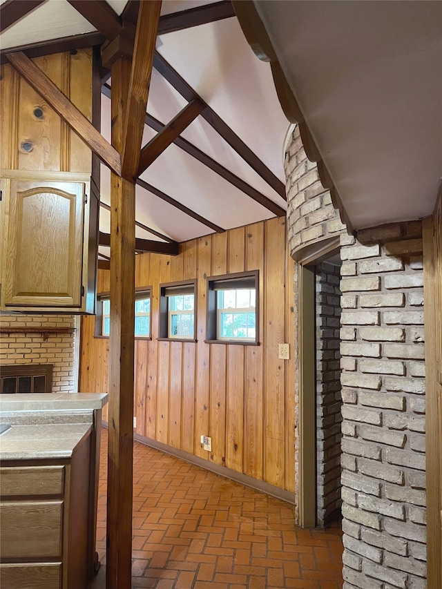 10214 Moorberry Ln, Houston, TX 77043 - interior space featuring brick floors, wooden walls, and baseboards