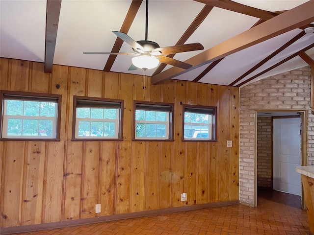 10214 Moorberry Ln, Houston, TX 77043 - unfurnished room featuring a ceiling fan, wood walls, and brick patterned flooring
