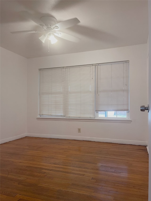 10214 Moorberry Ln, Houston, TX 77043 - unfurnished room with a ceiling fan, wood-type flooring, and baseboards