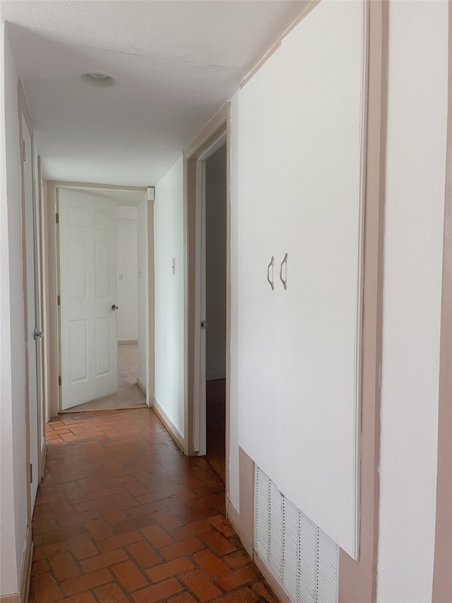 10214 Moorberry Ln, Houston, TX 77043 - corridor with baseboards and brick floors
