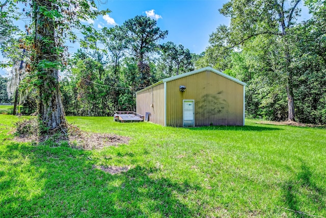 637 County Road 6502 E, Dayton, TX 77535 - view of grassy yard with an outbuilding