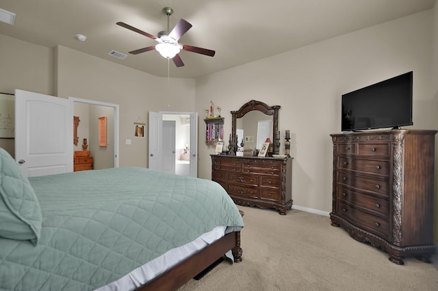 3909 Aspen Dr, Montgomery, TX 77356 - bedroom with light colored carpet, ceiling fan, baseboards, and connected bathroom