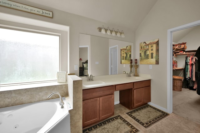 3909 Aspen Dr, Montgomery, TX 77356 - full bathroom with double vanity, a tub with jets, lofted ceiling, and a spacious closet