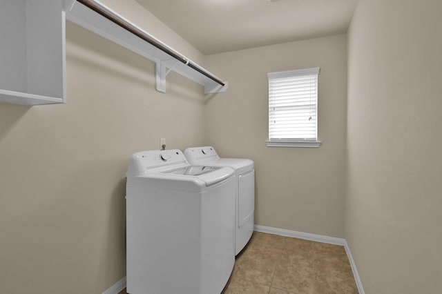 3909 Aspen Dr, Montgomery, TX 77356 - laundry area with washer and dryer and baseboards