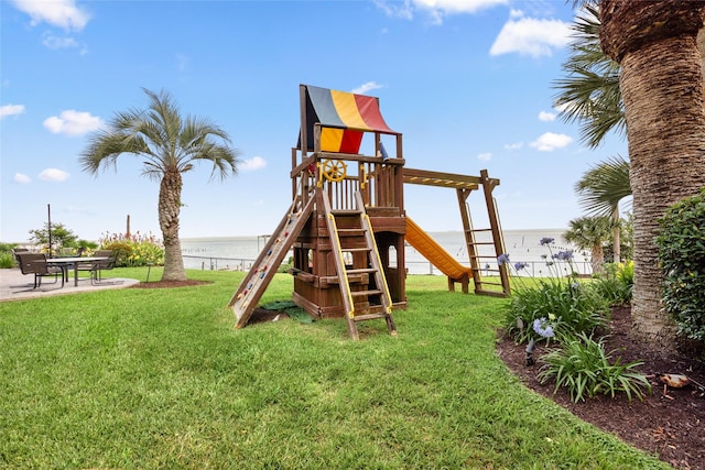 5123 W Bayshore Dr, Bacliff, TX 77518 - view of play area with a water view and a patio area
